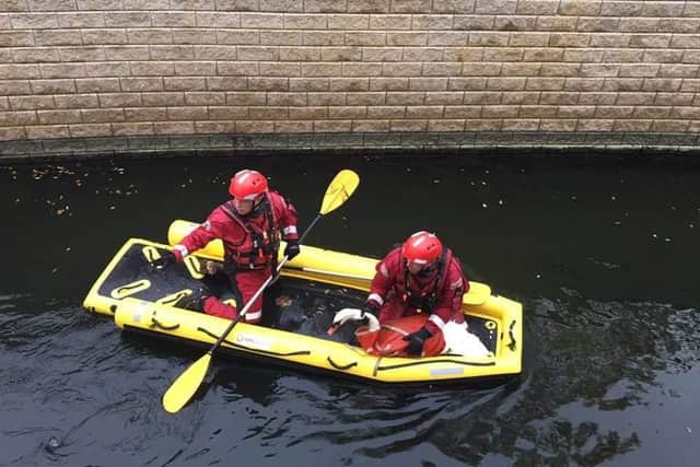 A swan being rescued in Hampton. Photo: Cambridgeshire Fire and Rescue Service