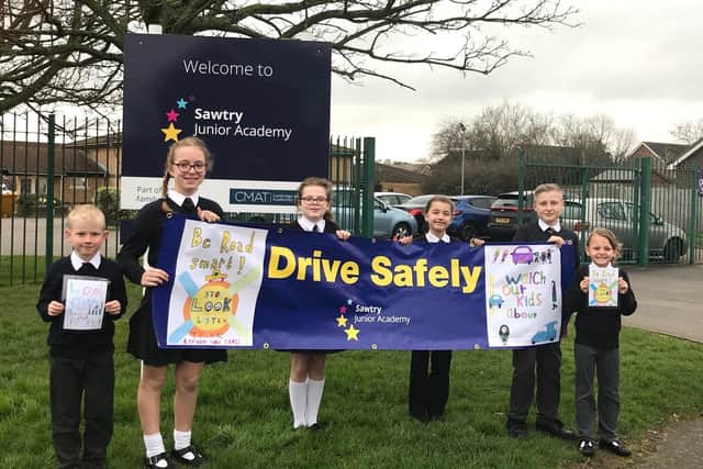 Pupils with the banner