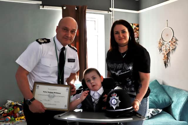 Tyler with hus mum and chief constable Nick Dean