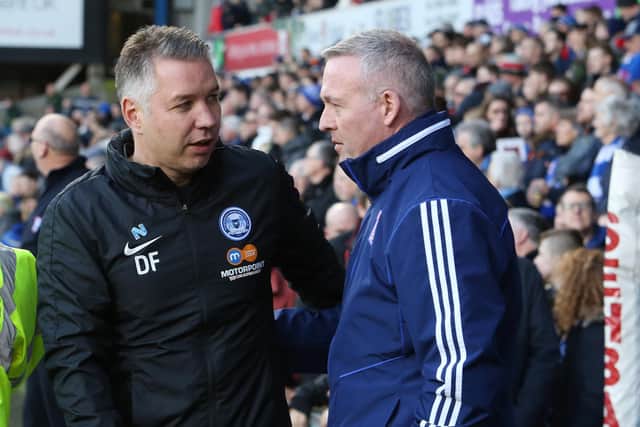 Rival managers Darren Ferguson of Posh (left) and Paul Lambert (Ipswich) could have been helped by a break in League One action.