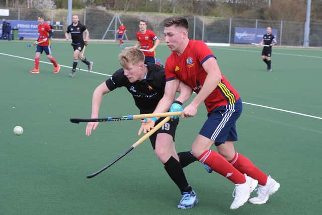 Brendan Andrews (red) scored for City of Peterborough at Bowdon