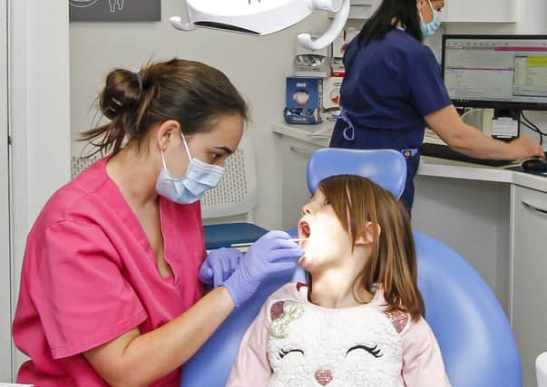 Dentist Beatriz Pastor and her young patient Mia O'sullivan
