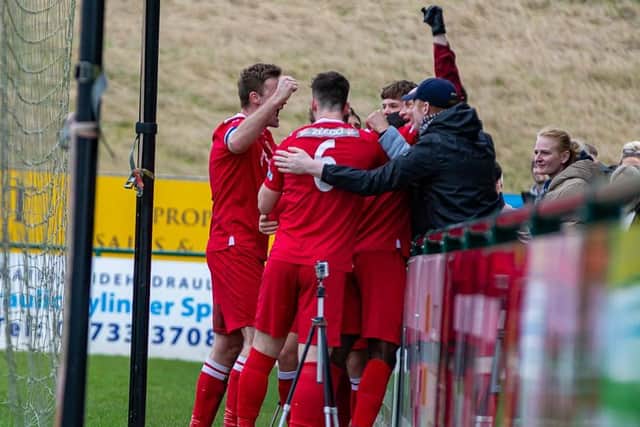 Stamford players celebrate a goal against Spalding with their fans. Photo: Dan Allen.