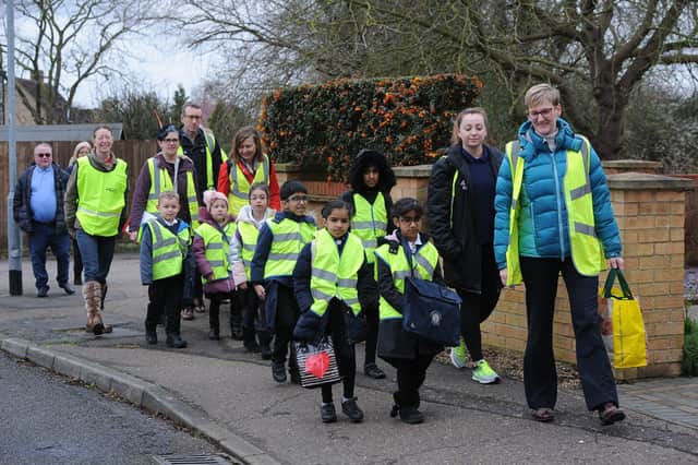 Schoolchildren's walking bus travelling from Longthorpe Green to Longthorpe Primary School. EMN-200316-120010009