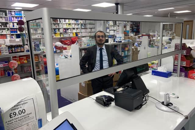 Mohammed Yasin with the screen at Werrington Pharmacy