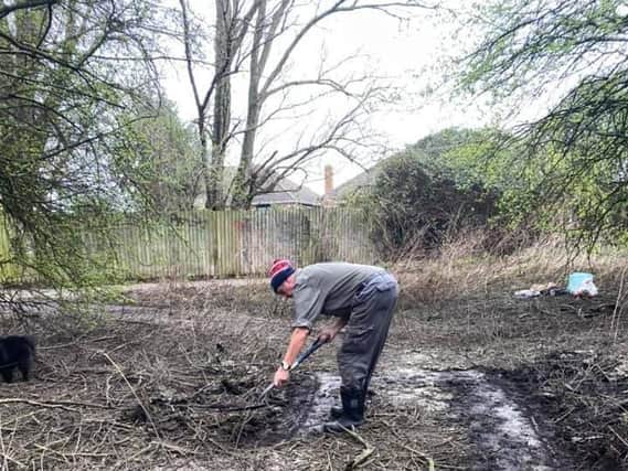 Chris Phillips hard at work clearing his local area.