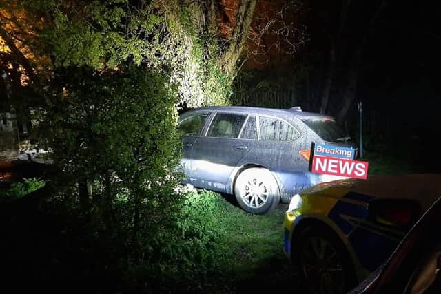 The car which got stuck in the tree. Photo: Cambridgeshire police