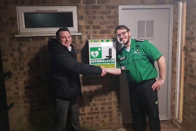 Bretton councillor Scott Warren with St John Ambulance unit manager Benjamin Smith