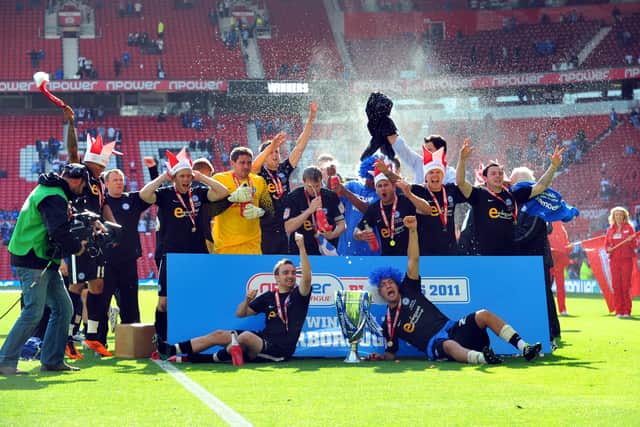 Posh celebrate their League One play-off final win over Huddersfield.