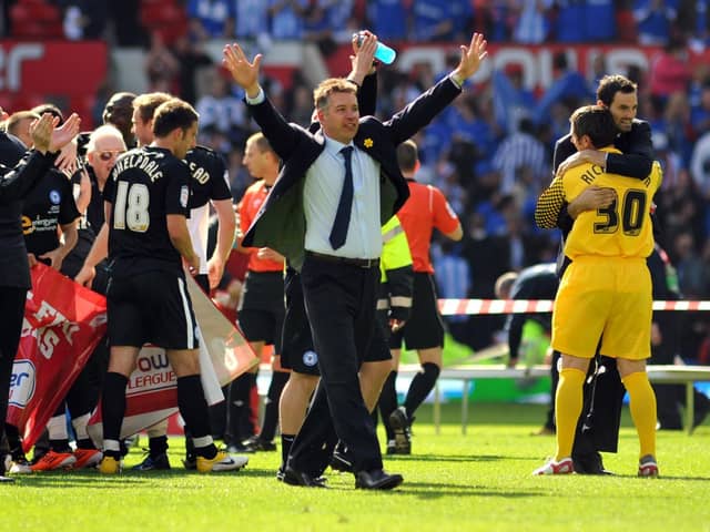 Darren Ferguson and his Posh team celebrate success at Old Trafford.