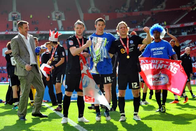 From left, Posh chairman Darragh MacAnthony, Grant McCann, Tommy Rowe and Craig Mackail-Smith enjoy the victory over Huddersfield.