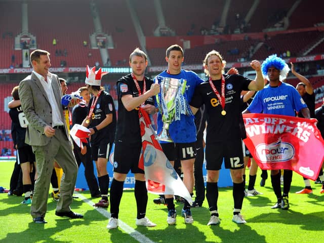 From left, Posh chairman Darragh MacAnthony, Grant McCann, Tommy Rowe and Craig Mackail-Smith enjoy the victory over Huddersfield.
