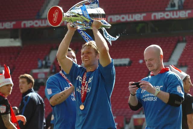 Craig Mackail-Smith with the League One play-off trophy.