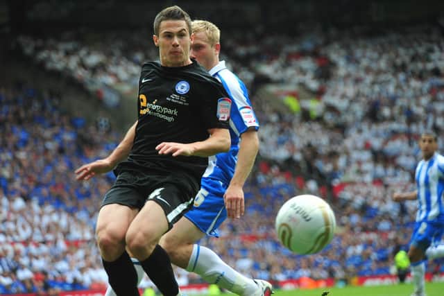 Tommy Rowe in action for Posh v Huddersfield at Old Trafford.