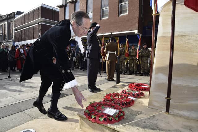 Remembrance Sunday in Peterborough City Centre. High Sheriff Neil McKittrick laying wreath EMN-191011-212838009