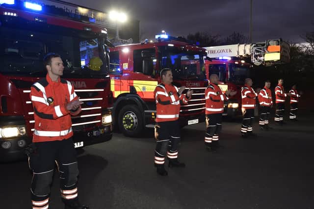 Firefighters at Stanground Fire Station join the public applause to support the NHS and to press home the messages of Stay at Home and Keep social distancing.