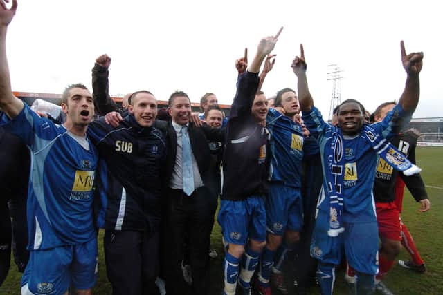 Darren Ferguson and his Posh players celebrate winning promotion at Hereford in 2008.