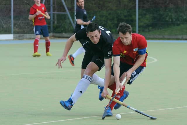 Ross Booth (red) in action for City of Peterborough.