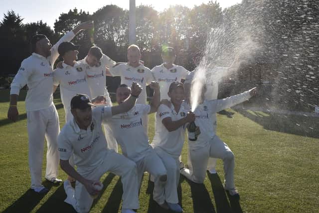 Peterborough Town CC celebrate their Northants Premier Division title success last season.