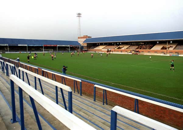 A scene from Posh v Kingstonian, an FA Cup first round replay staged behind closed doors at London Road in 1992.