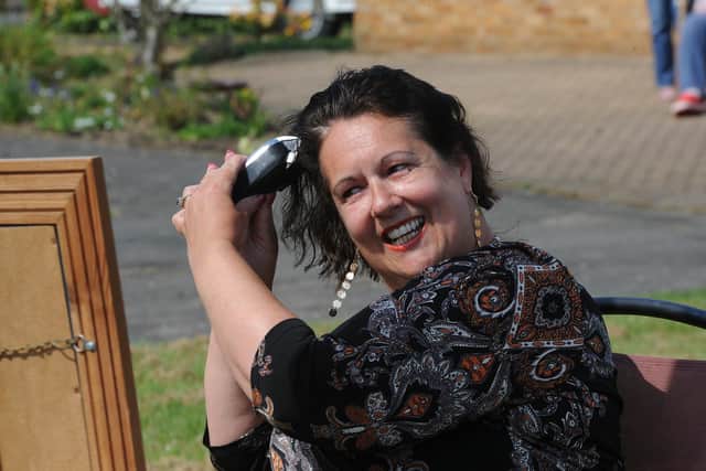 Sally Dowers from Whittlesey doing her own head shave to raise funds for Sue Ryder