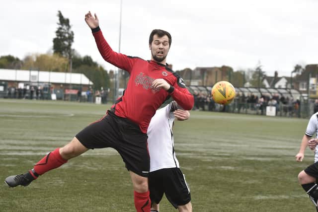 Netherton United (red) in action against Long Sutton Athletic in February.