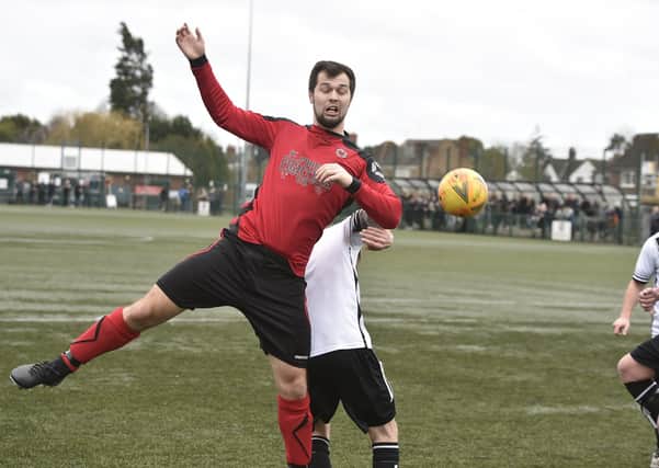 Netherton United (red) in action against Long Sutton Athletic in February.