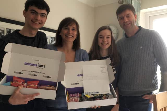 Charis’ IT director Chris Loader with his family enjoying the new picnic box.