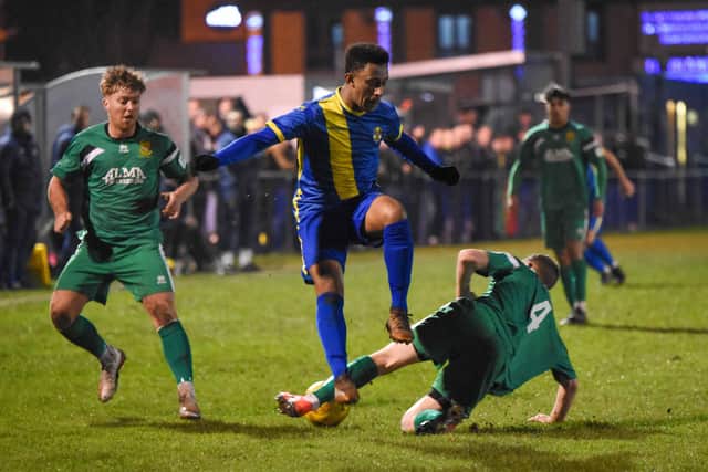 PT Footballer of the Year Dion Sembie-Ferris in action for Peterborough Sports (blue).