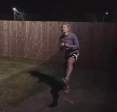 Atlanta Hickman doing her kicking marathon in her garden