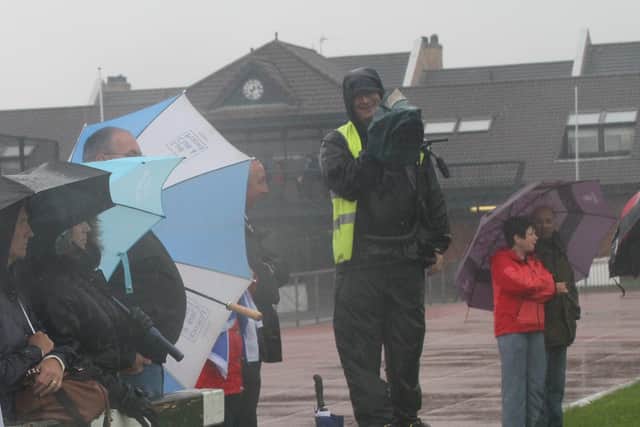 Robert Windle filming in the rain. Photo: RWT Photography.