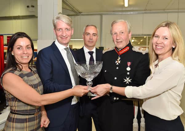 The presentation of Photocentric's first Queen's Award in 2016 - Sir Hugh  Duberly, the Lord Lt of Cambs with Amanda Keating, production director,  Paul Holt (MD), Agustin Soriano, marketing director  and Sally Tipping, sales director.
60726-084627009