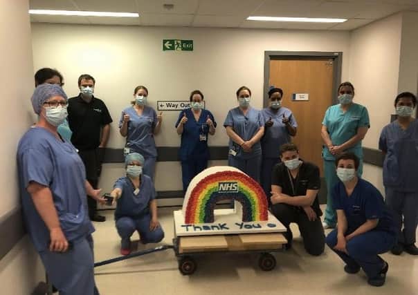Peterborough City Hospital staff with the rainbow cake