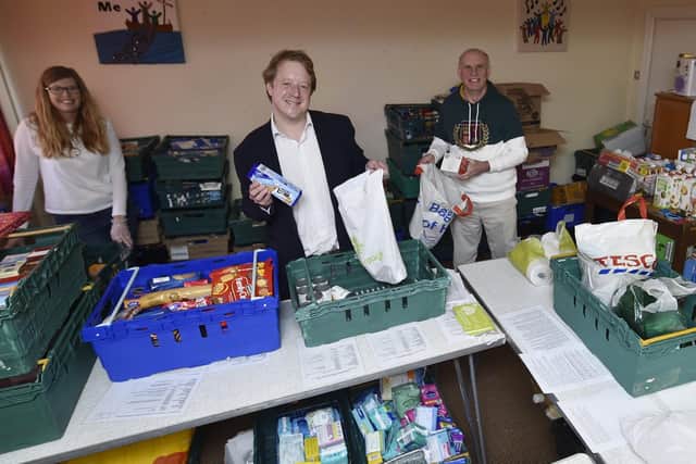MP for Peterborough Paul Bristow with John Peach visiting the food bank at Dogsthorpe Methodist Church. Foodbank manager Juliette Welch (left) and Fiona Todd from the Salvation Army (right). It is volunteers like this he wants to recognise for their efforts.