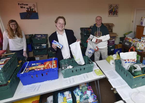 MP for Peterborough Paul Bristow with John Peach visiting the food bank at Dogsthorpe Methodist Church. Foodbank manager Juliette Welch (left) and Fiona Todd from the Salvation Army (right). It is volunteers like this he wants to recognise for their efforts.