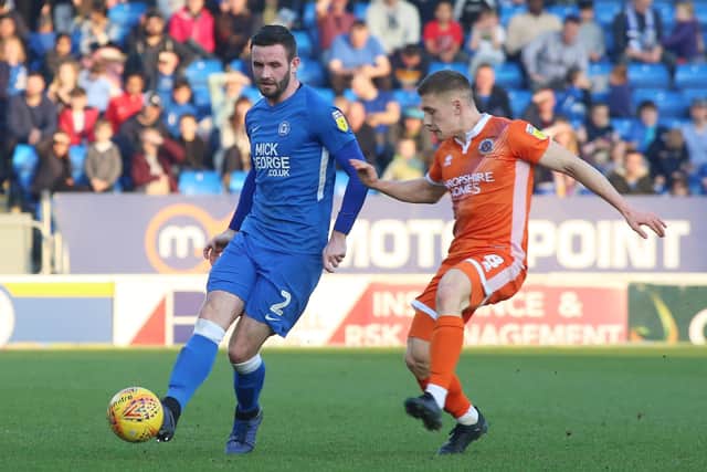 Jason Naismith(left) in action for Posh