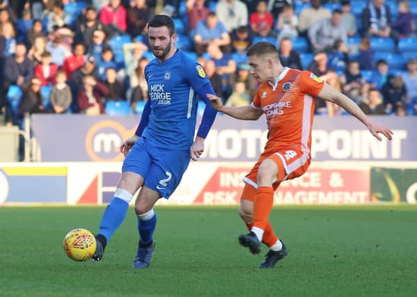 Jason Naismith(left) in action for Posh