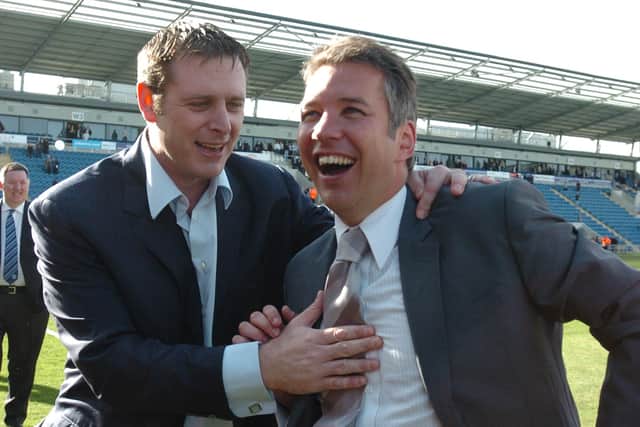 Posh chairman Darragh MacAnthony (left) and manager Darren Ferguson celebrate promotion at Colchester.