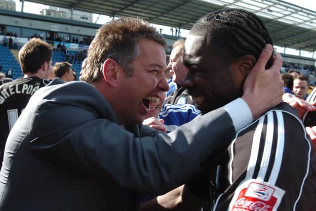 Posh manager Darren Ferguson (left) celebrates promotion at Colchester with star striker Aaron Mclean.