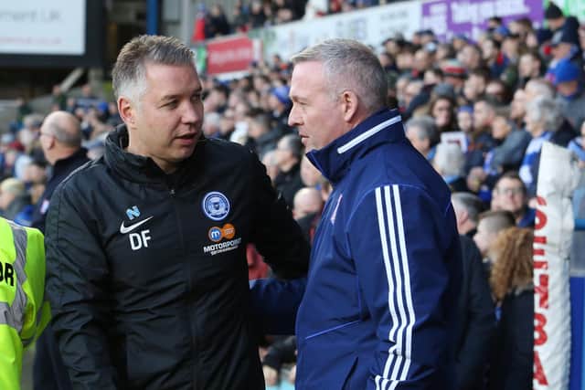 Rival bosses Darren Ferguson of Posh (left) and Paul Lambert of Ipswich Town.