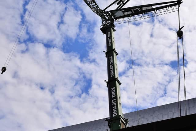Giant crane ready for work outside Queensgate shopping centre. EMN-200105-122706009