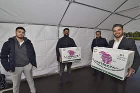 Muhammad Sharafat (consultant Intensivist) with Dr Asad Qayyum, Cllr Amjad Iqbal and his son Nouman Ali donating food to staff at the city hospital EMN-200430-214520009