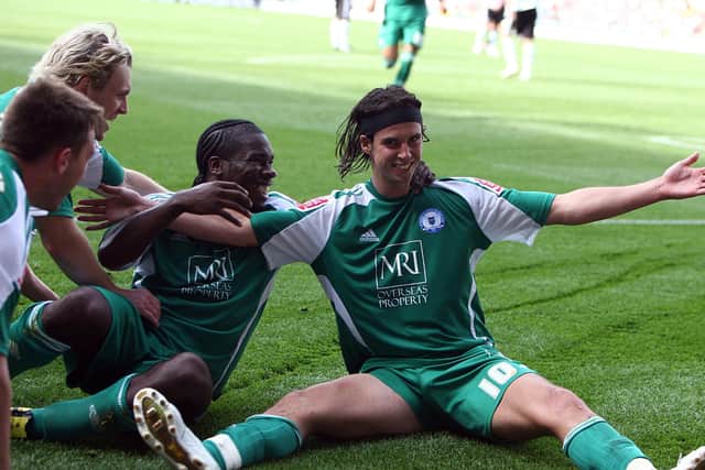 George Boyd celebrates a goalfor Posh against Derby on the opening day of the 2009-10 Championship season with Craig Mackail-Smith and Aaron Mclean