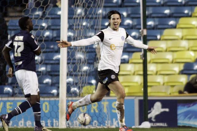 George Boyd celebrates a goal on his farewell Posh appearance at Millwall in 2013.
