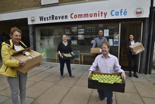 Ishfaq Hussain, Paul Bristow MP and Jagoda Kwiatkowska supplying food to   Margaret Prince and Christine Nice (left) at the WestRaven Community Café who are supplying food to the needy. EMN-200405-164108009