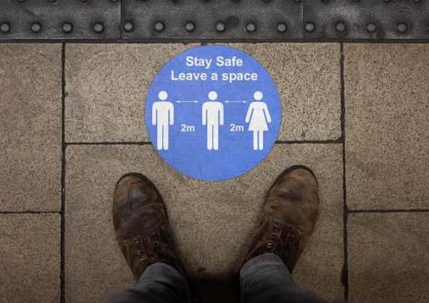 A social distancing sticker is seen on an underground station platform  (Photo: Leon Neal/Getty Images)