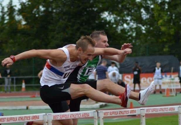 Sean Reidy in hurdles action.