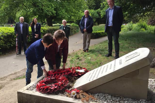 Wreath laying at the grave of Jimmy the Donkey at Central Park. A small gathering included Paul Bristow MP for Peterborough and youngsters Alexander (6) and Jessica (8) Dickinson EMN-201205-085144009