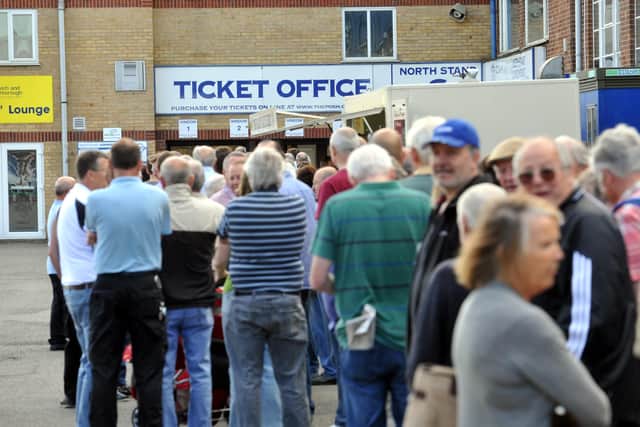 A queue for Posh season tickets.