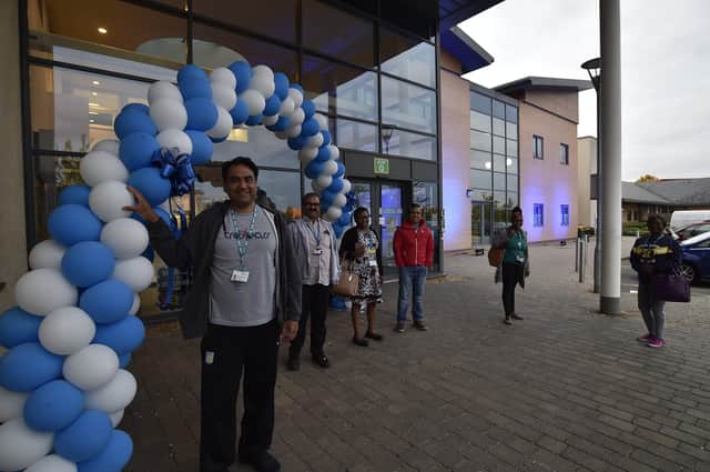Staff from the Peterborough NHS Foundation Trust at the Cavell Centre, PCH site -  with their building lit in blue for the NHS EMN-201205-221953009